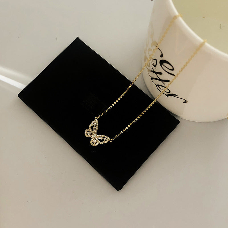 Close-up of crystal butterfly pendant
