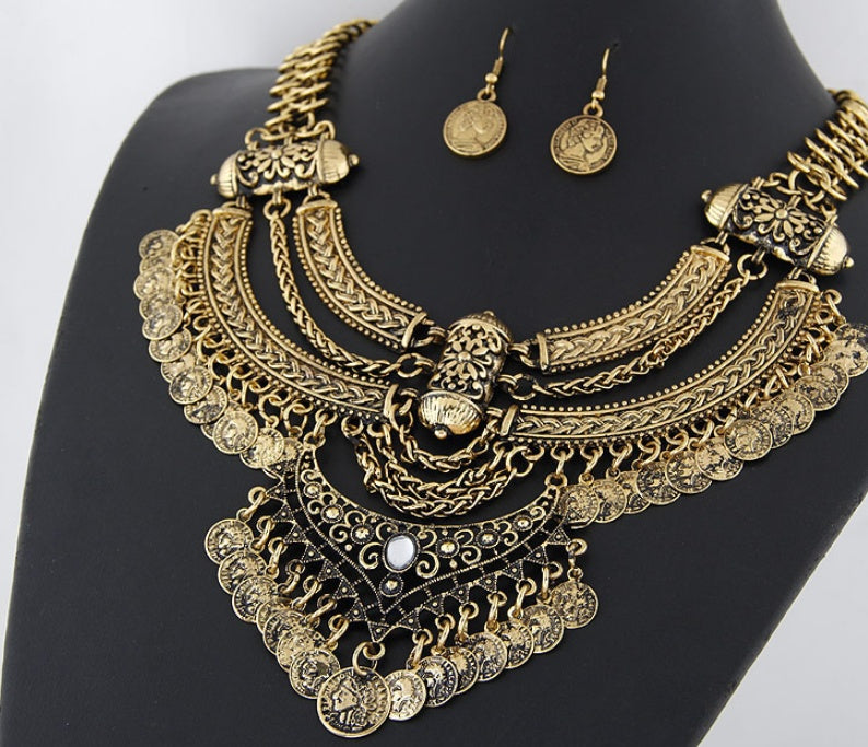 Layered tribal coin necklace laid flat