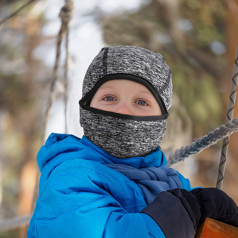 Child wearing a heather gray kids' balaclava hood outdoors
