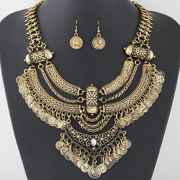 Oxidized coin necklace set on a display bust