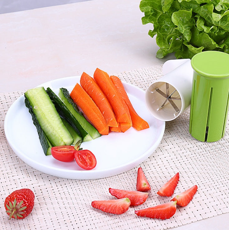 Carrot being pushed through the slicer into even sticks