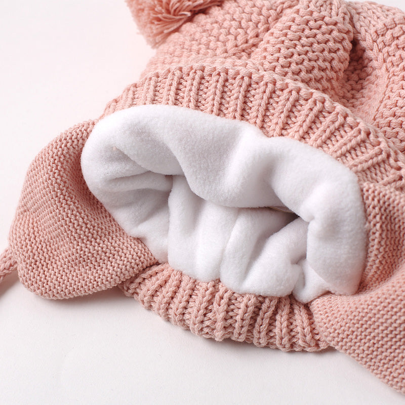 Soft fleece lining inside the kids knit pom pom beanie