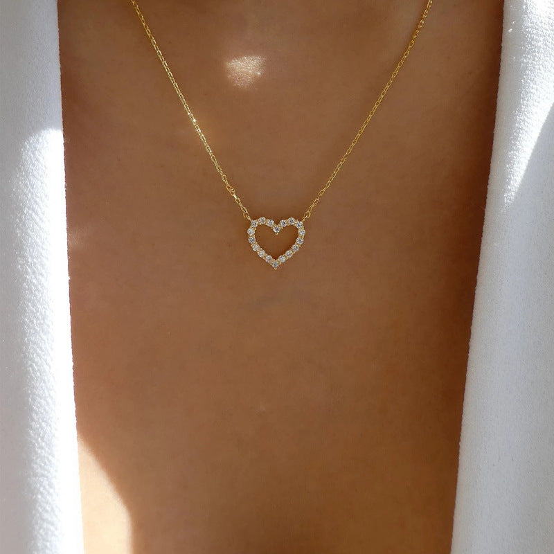 Heart and butterfly necklace laid flat