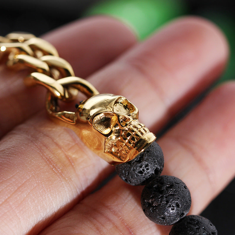 Lava stone beaded bracelet coiled on a neutral surface