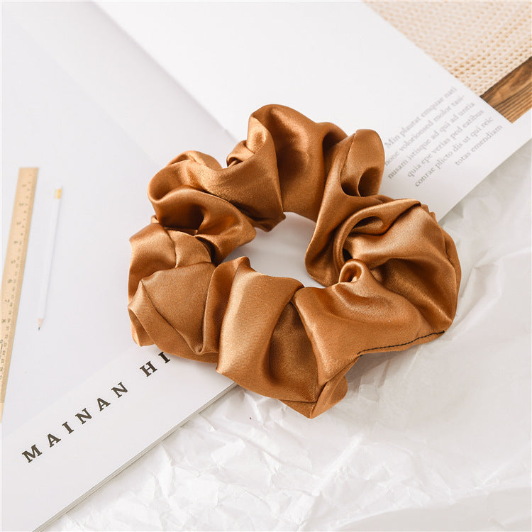 Satin scrunchie holding a thick ponytail