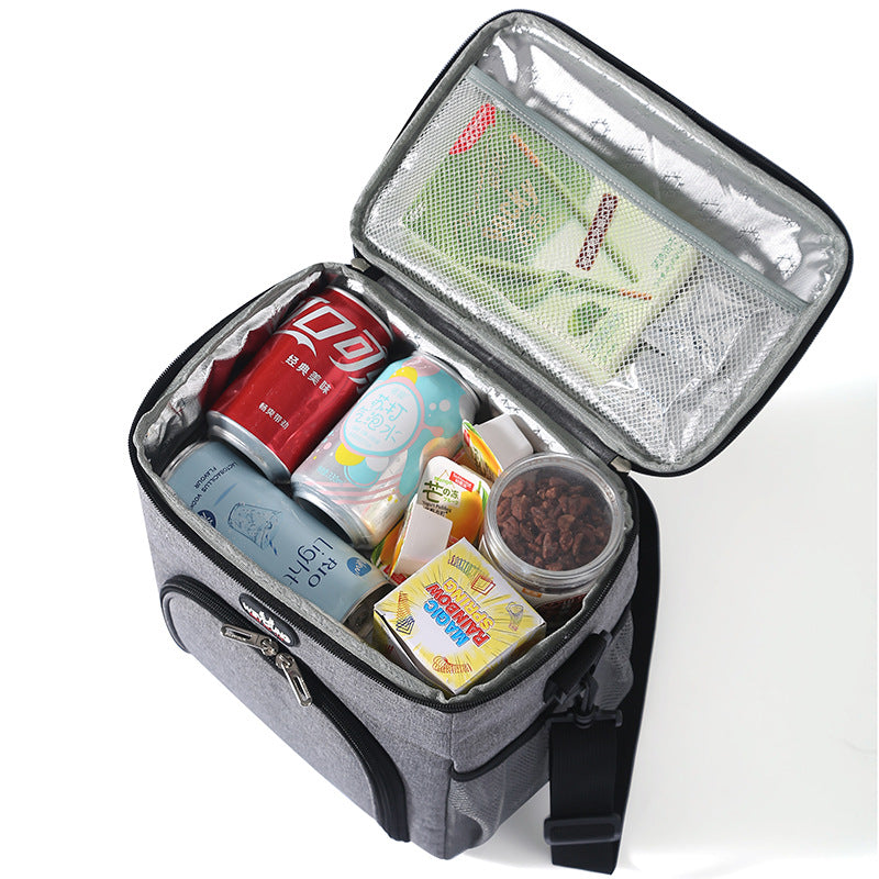 Insulated double lunch bag carried by the handle