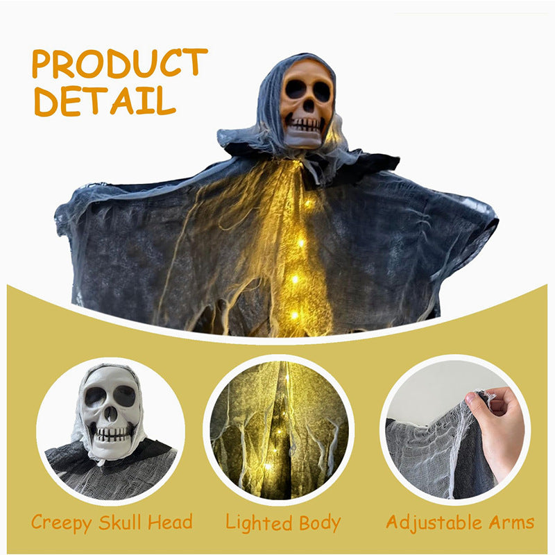 Hanging ghost detail: skull head, warm LED lighted body and adjustable arms