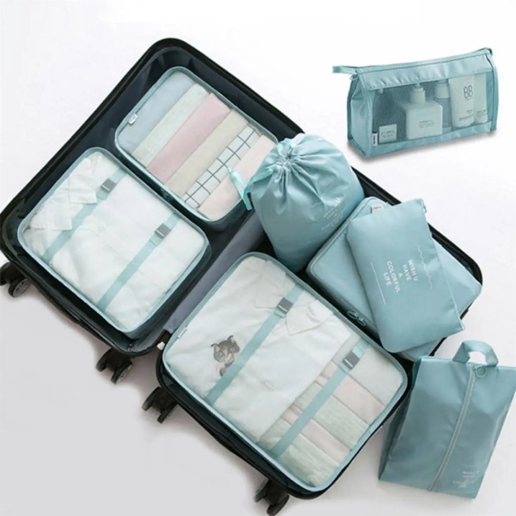 Travel packing cubes stacked in a suitcase