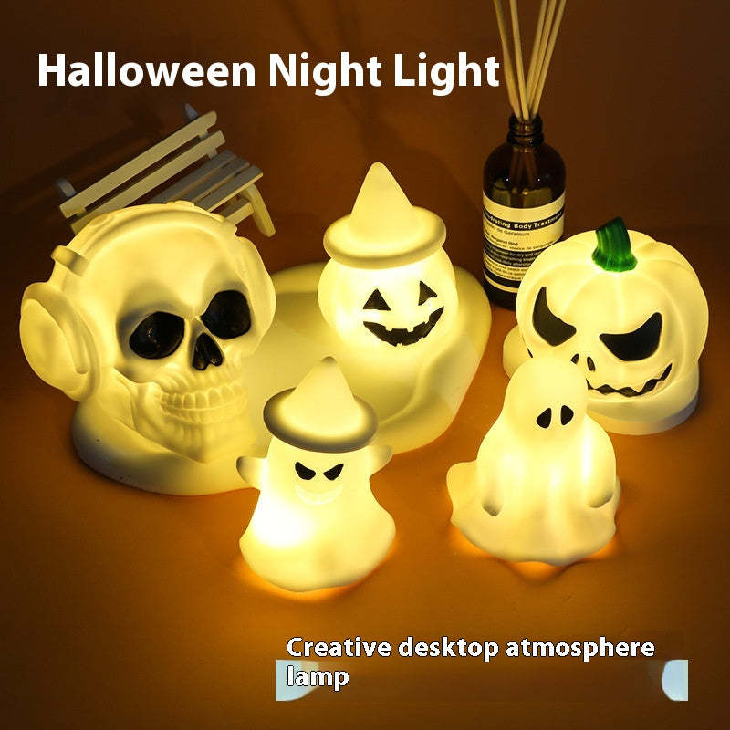 Halloween LED ghost and pumpkin night lamp on a shelf