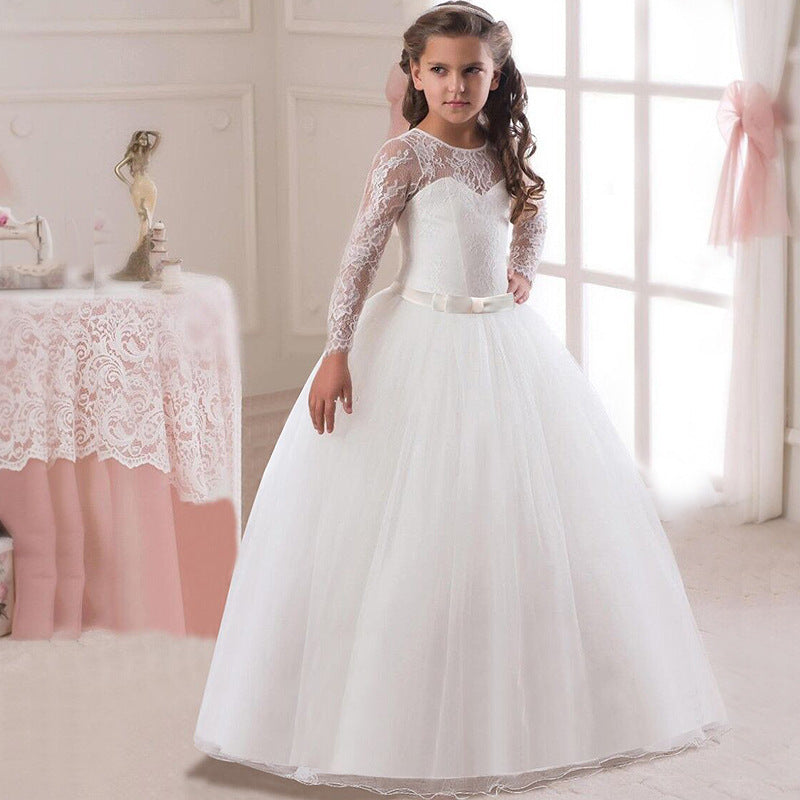 Girl wearing a white lace long sleeve tulle dress