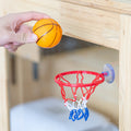 Mini red basketball hoop with suction cup and orange ball