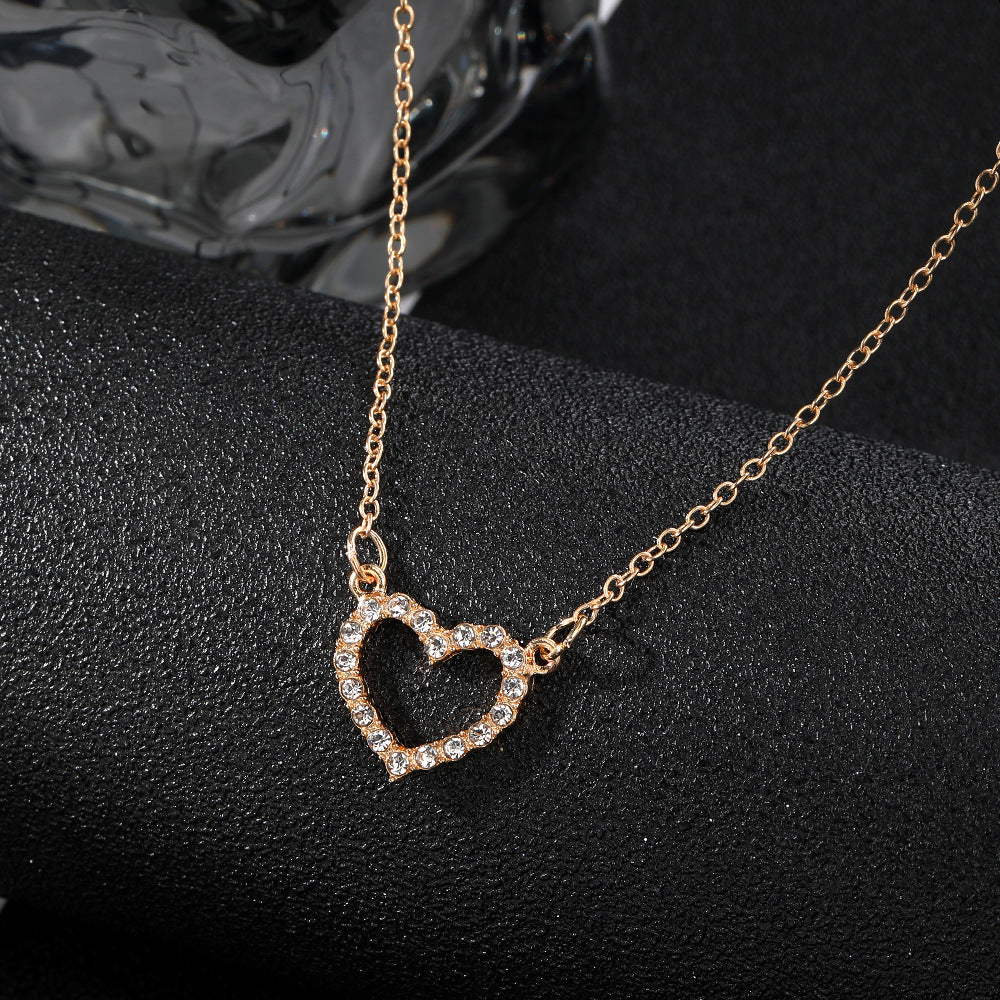 Rhinestone butterfly charm on gold-tone chain