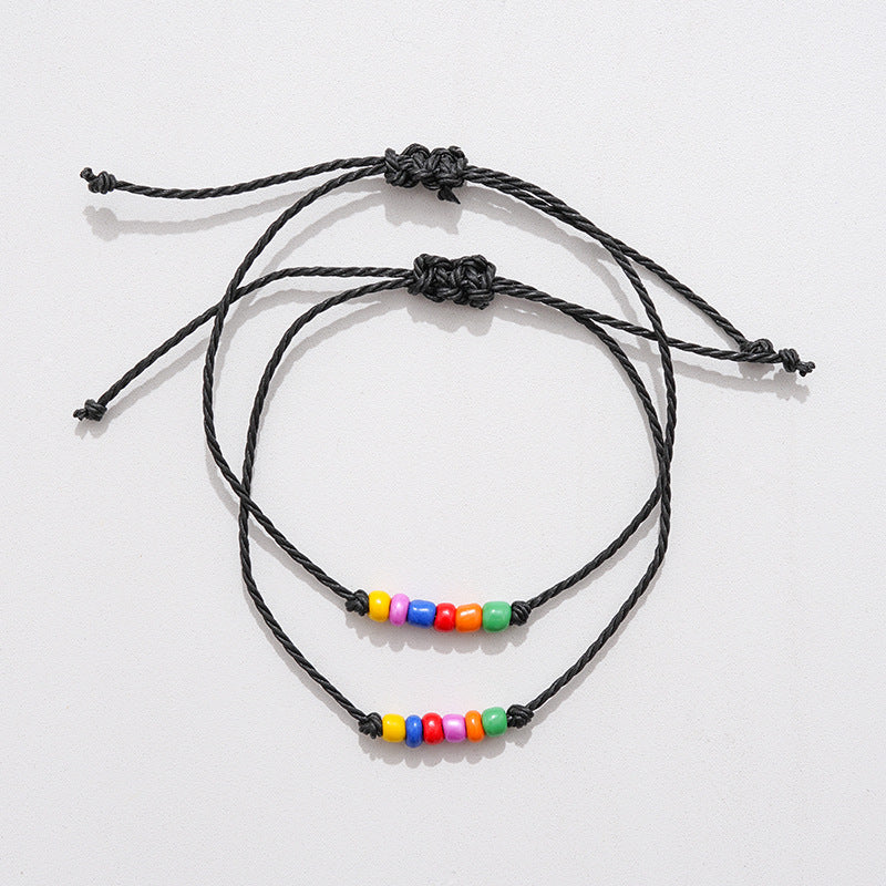 Pair of rainbow beaded friendship bracelets