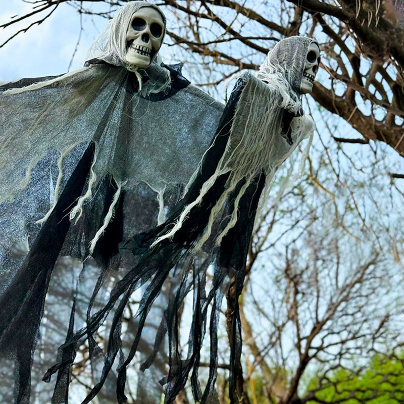 85 cm hanging ghost decoration with tattered cloth shown outdoors in daylight