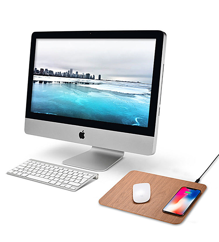 Wood-grain charging mouse pad on a home office desk