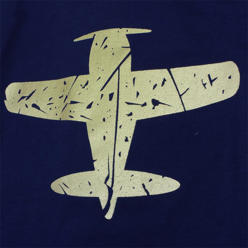 Close-up of the airplane print on the navy T-shirt
