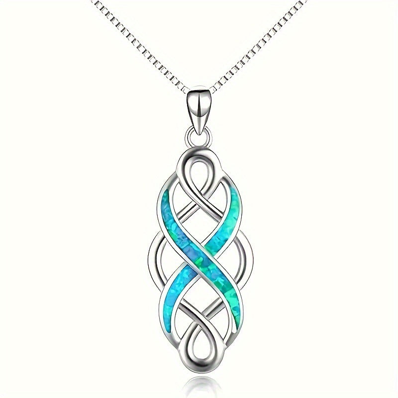 Celtic knot pendant necklace laid flat on light fabric