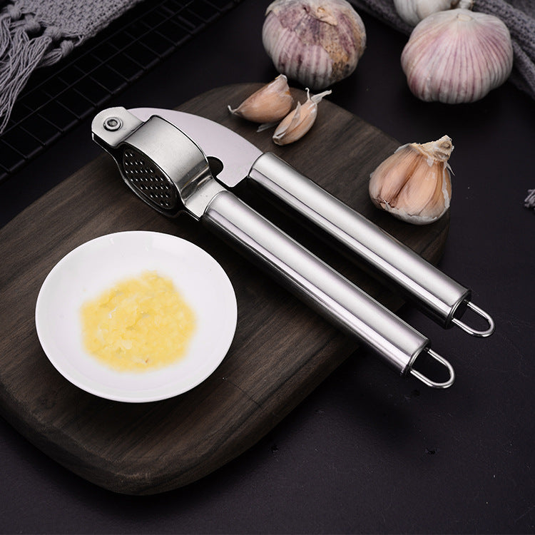 Garlic press open for rinsing