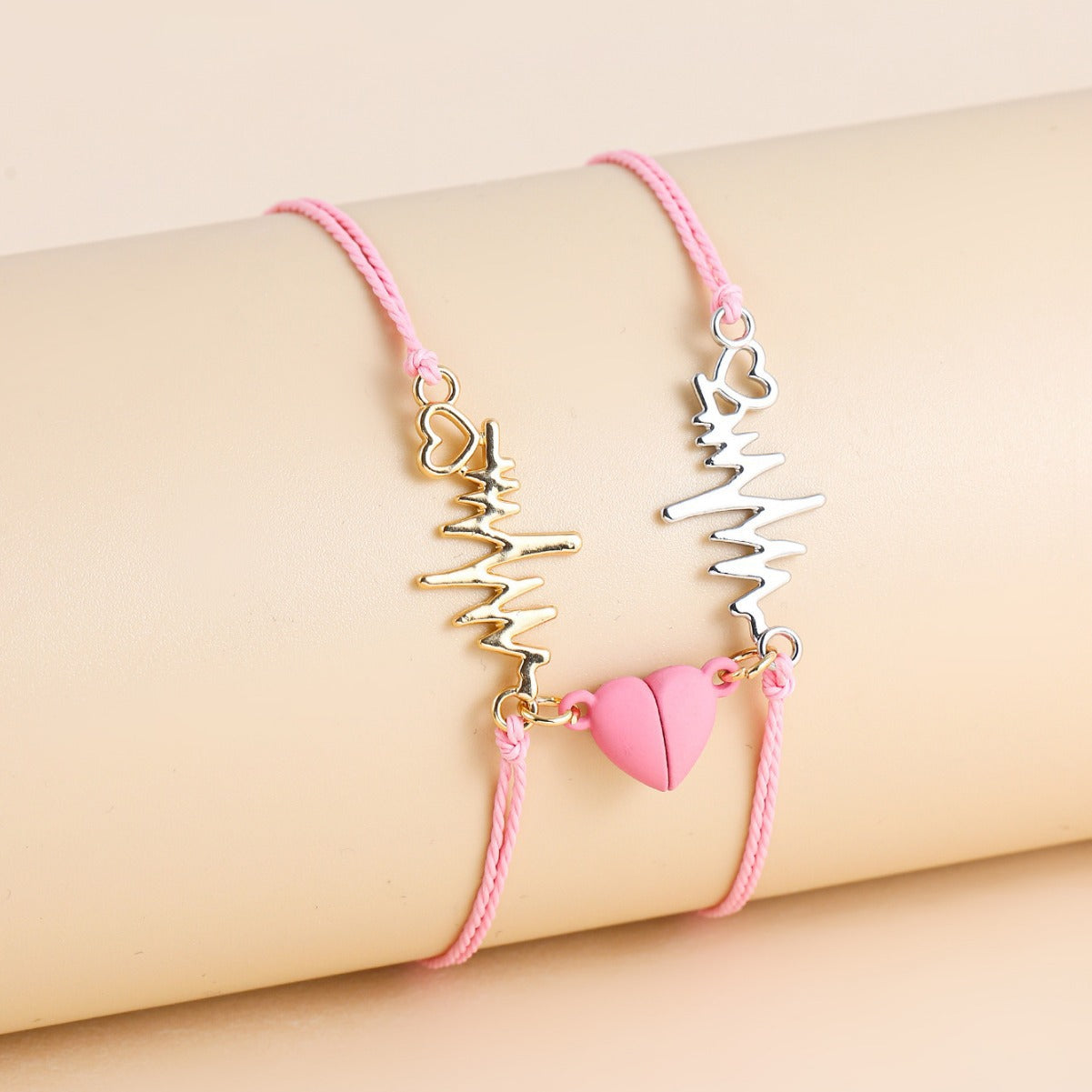 Couple wearing matching heartbeat bracelets on both wrists