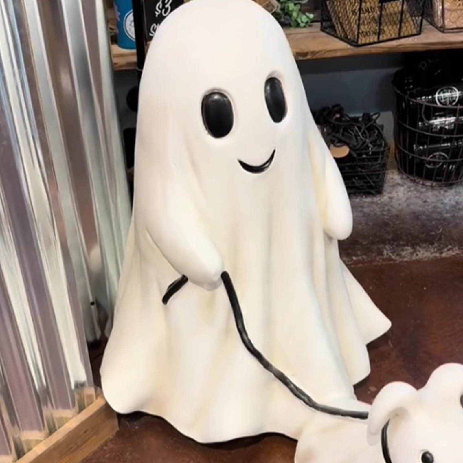 Halloween ghost walking a dog desktop ornament on a shelf