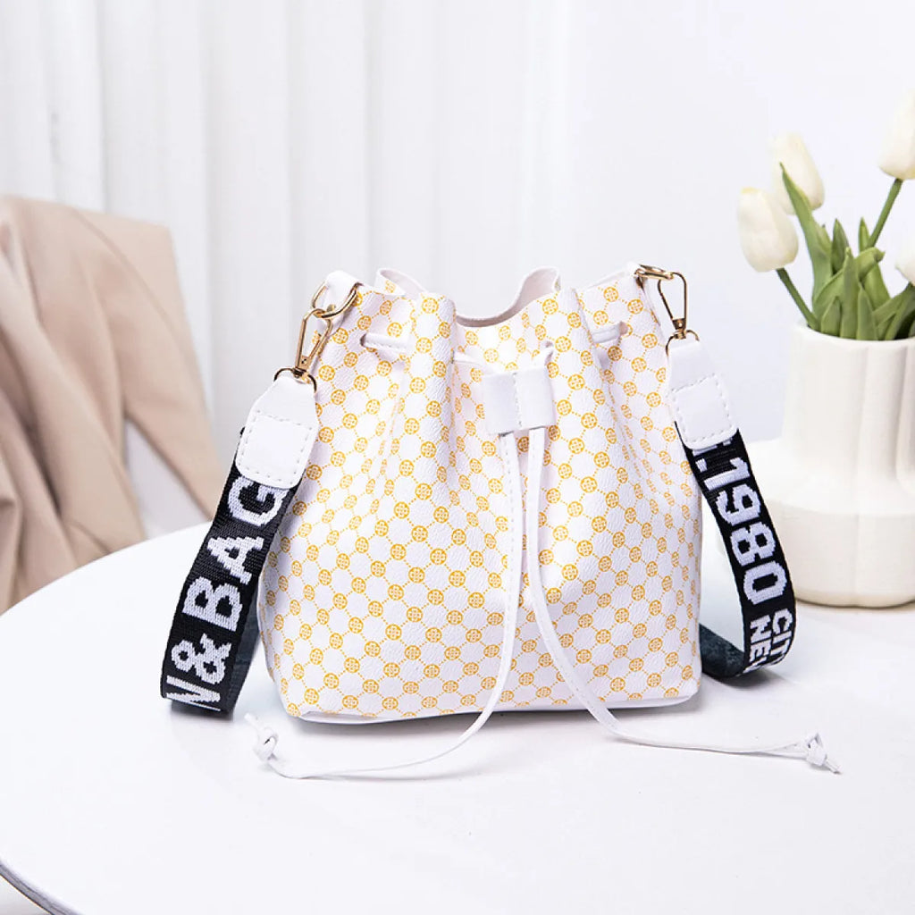 Women's beige PU bucket crossbody bag with adjustable strap