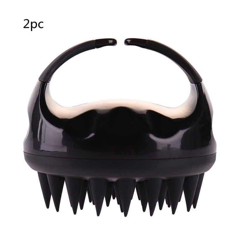 Silicone scalp shampoo brush in the hand