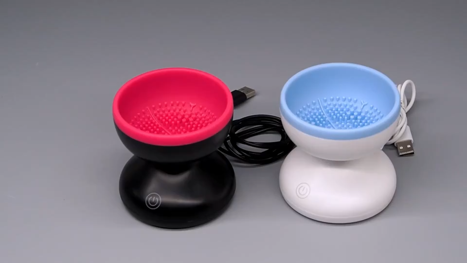 Portable USB electric makeup brush cleaner spinning a foundation brush view 2