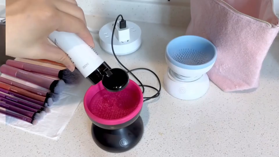 Portable USB electric makeup brush cleaner spinning a foundation brush view 3