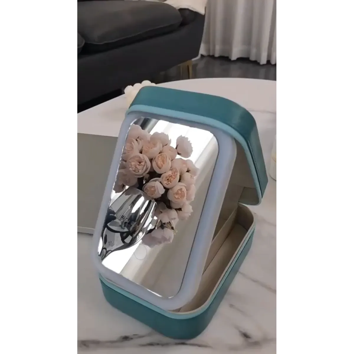 LED makeup mirror box open showing compartments