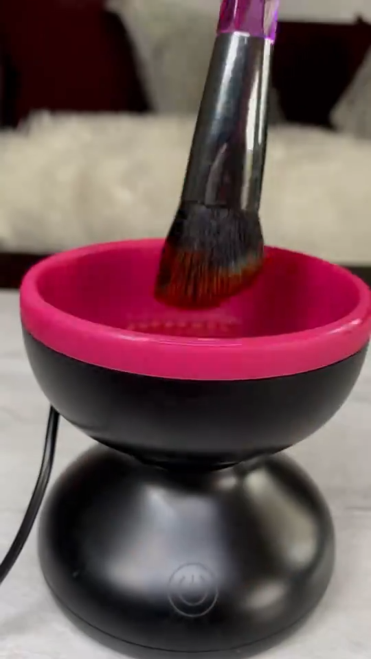 Portable USB electric makeup brush cleaner spinning a foundation brush view 4