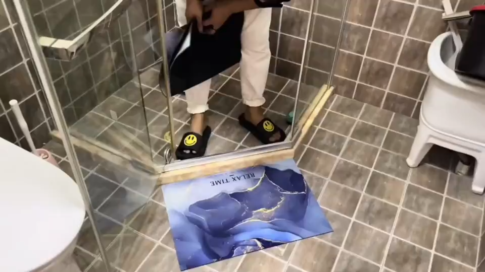 Quick-dry diatomite bath mat on a bathroom floor