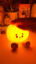 Soft silicone Halloween pumpkin night light glowing warm orange
